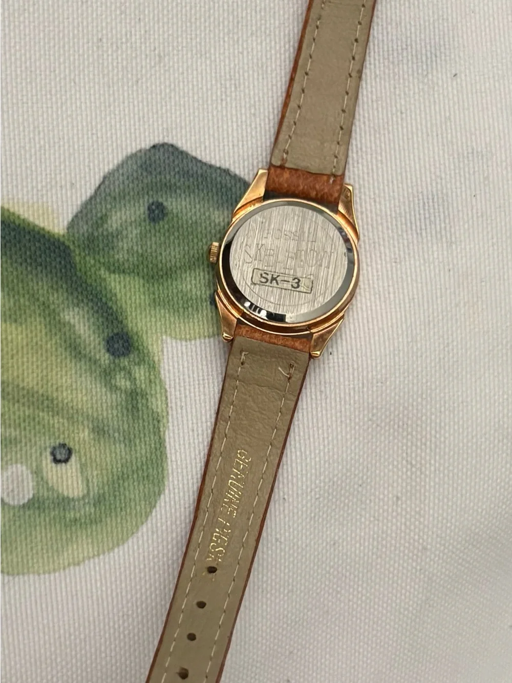 Gold-Tone Skeleton Dial Watch with Brown Leather Strap